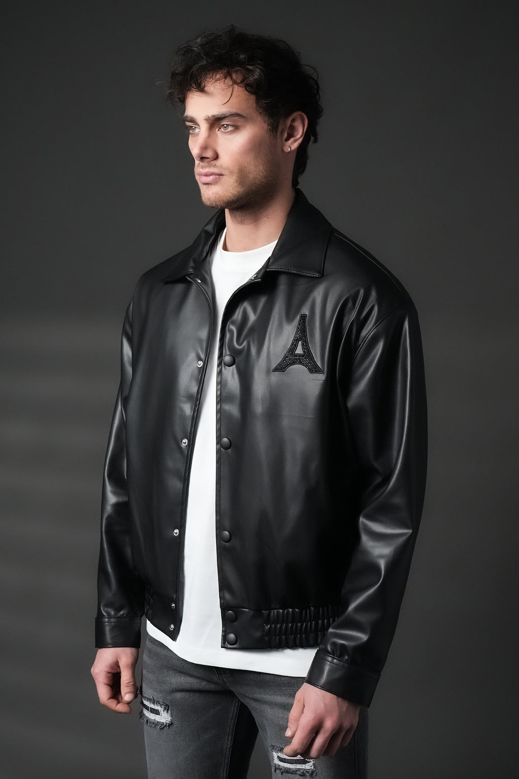 Blouson homme simili cuir noir oversize, Tour Eiffel en strass dans le dos, col chemise à pressions