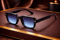 Lunettes de soleil rectangulaires monture noire épaisse losange bonhommeboutique