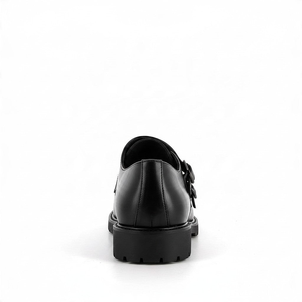 Vue arrière de la chaussure monk strap noire bonhomme en simili cuir avec semelle crantée épaisse et double boucle
